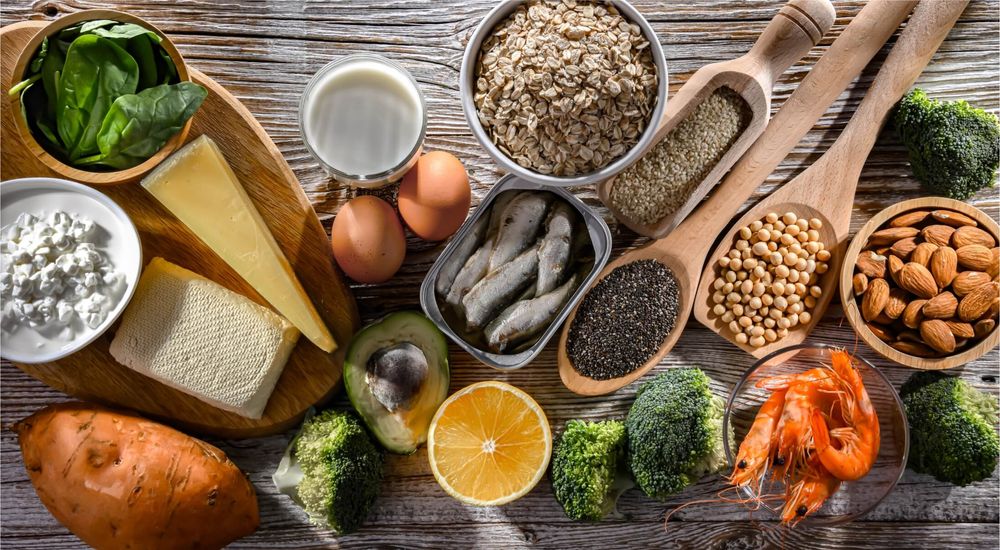 Assorted healthy foods on a wooden table.
